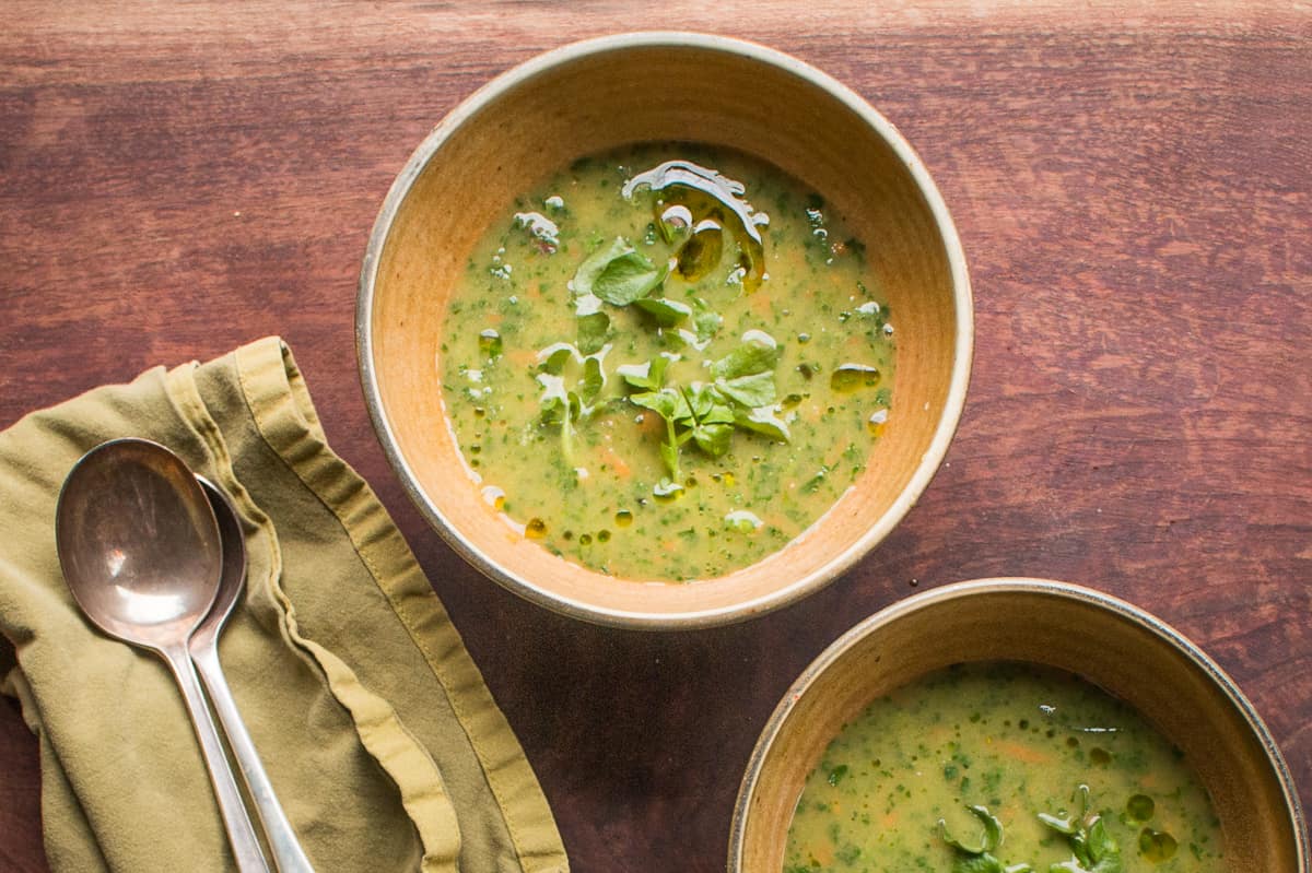 Rustic watercress soup with carrots and ramp leaves