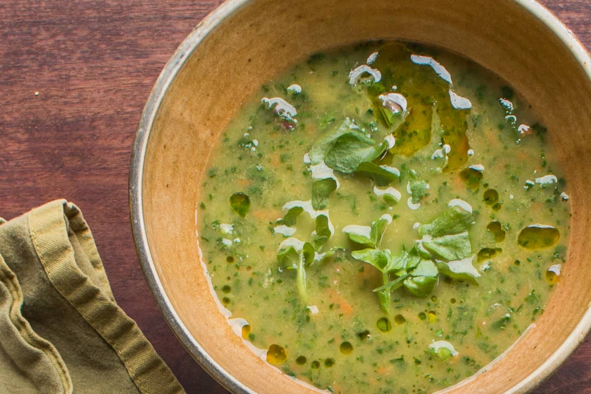 Rustic watercress soup with carrots and ramp leaves