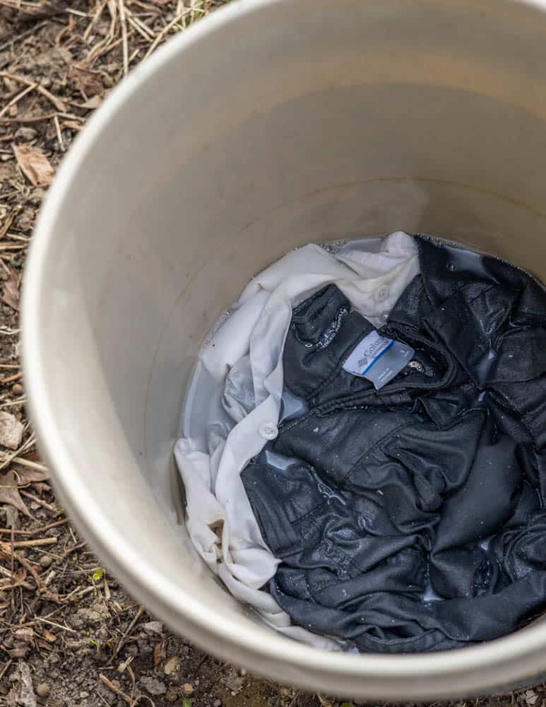 Soaking clothes in permethrin