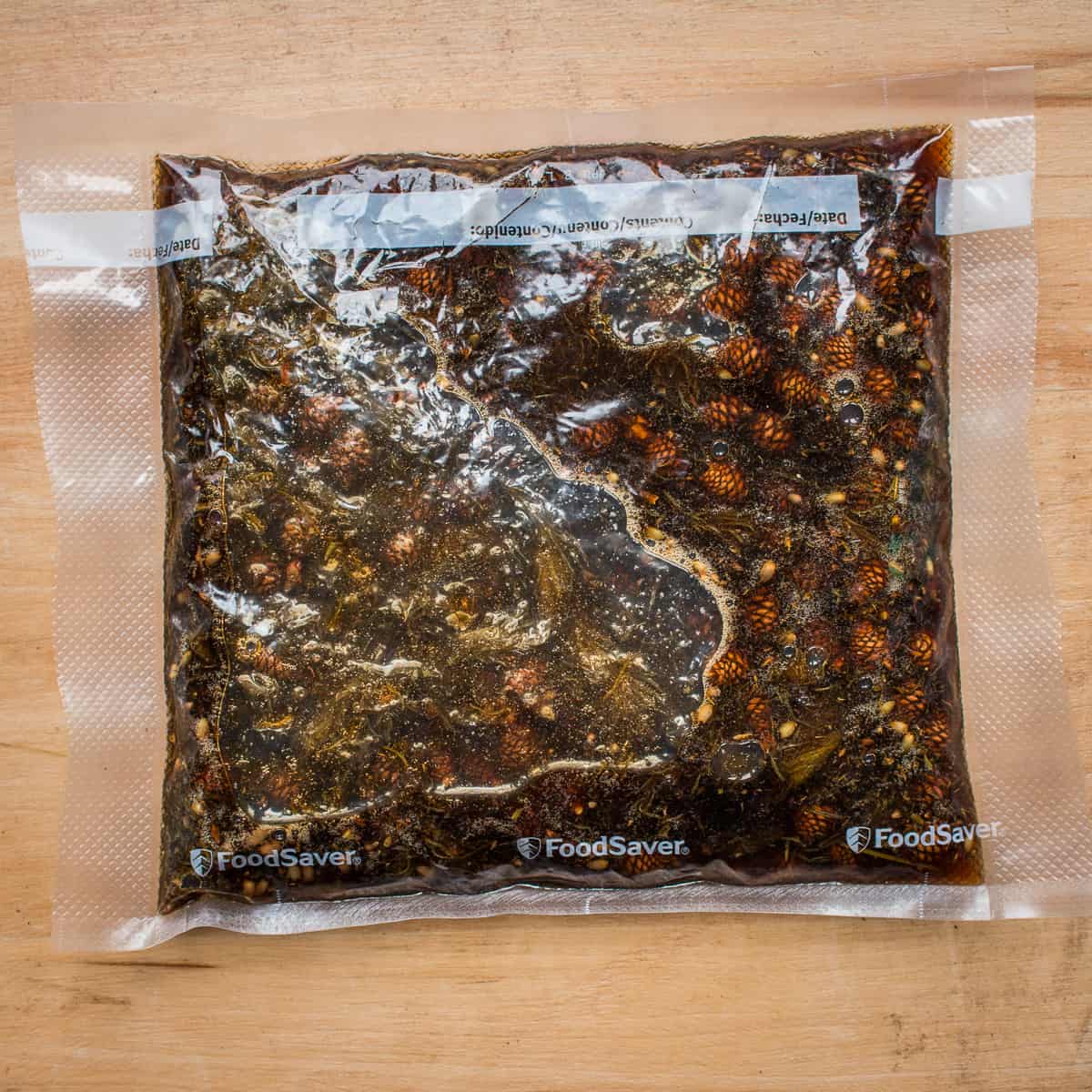 Vacuum sealed spruce tip and pine cone syrup