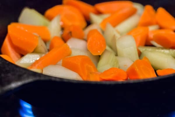 Sauteing burdock flower stalks and carrots