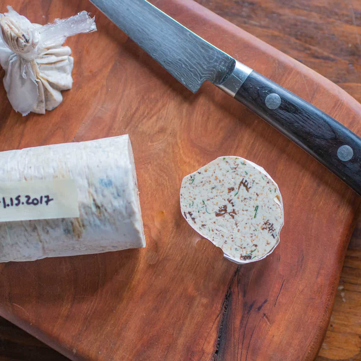 cutting a slice of mushroom butter 