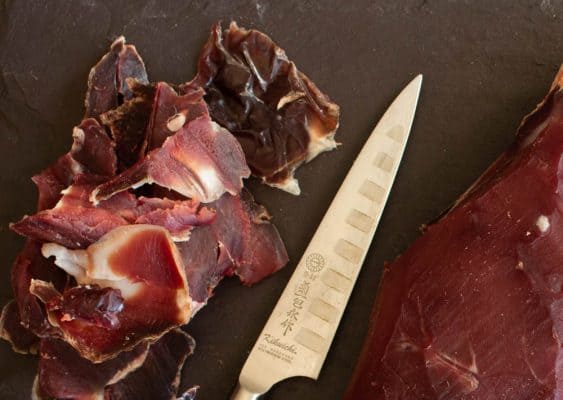 Trimming a dry aged leg of venison