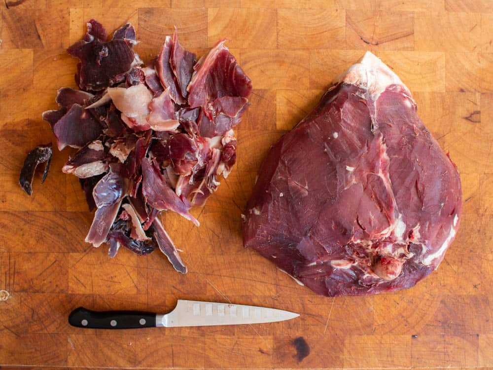 Trimming a dry aged leg of venison