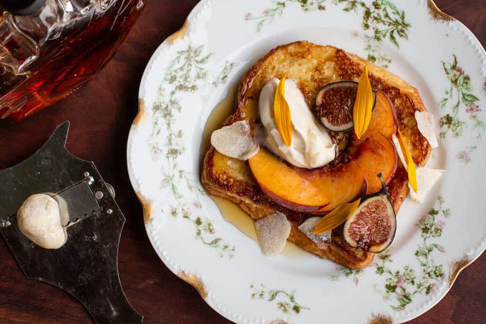 French toast with honey truffles, peaches and creme fraiche