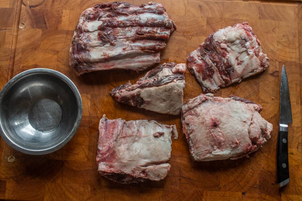 trimming the fat from deer or venison ribs before cooking