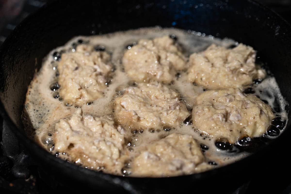 cooking brain fritters in a cast iron pan 