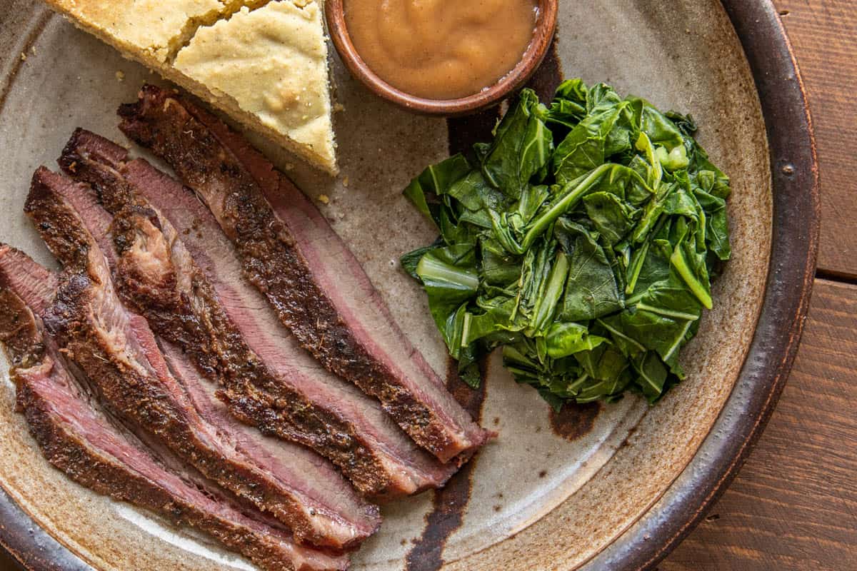 Smoked venison brisket recipe with collard greens and wild plum sauce