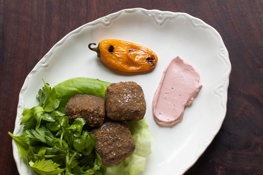 Fried venison trotter cakes with watercress, highbush cranberry aioli, and roasted pepper