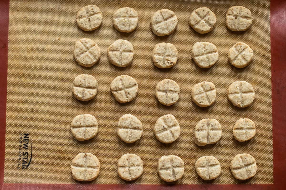 baked candy cap cookies on a silicone mat