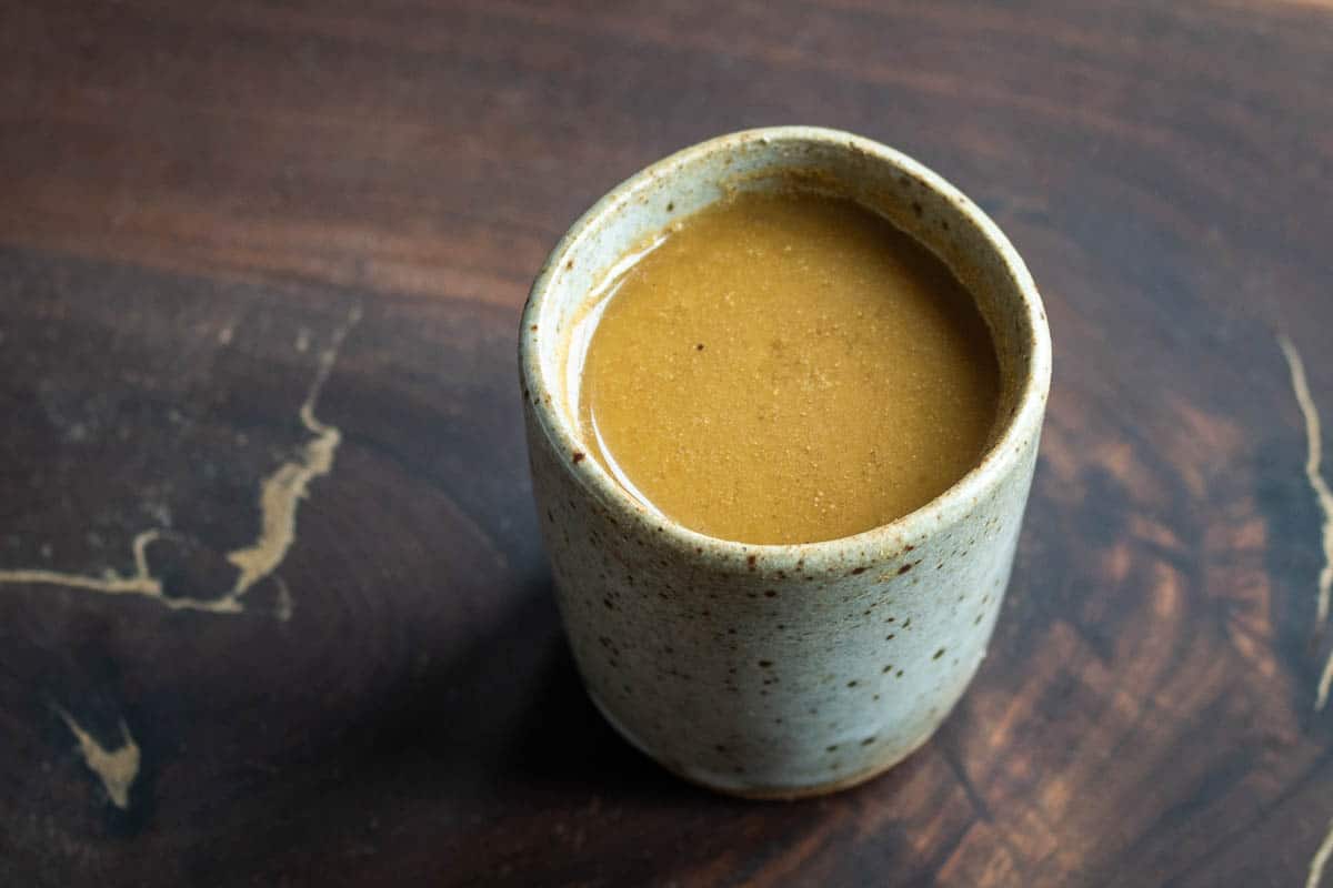 hackberry milk recipe in a small ceramic cup. 