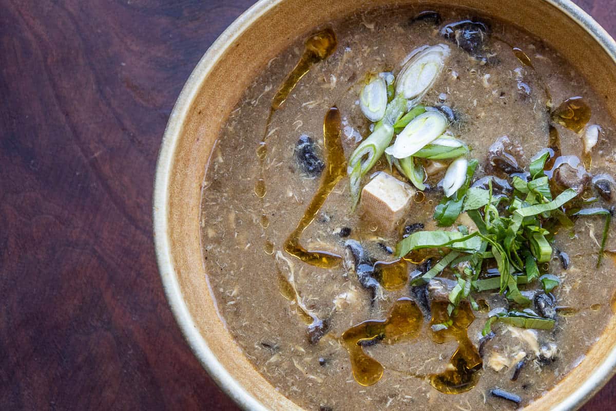 Hot and sour soup with wood ear and yellowfoot mushrooms