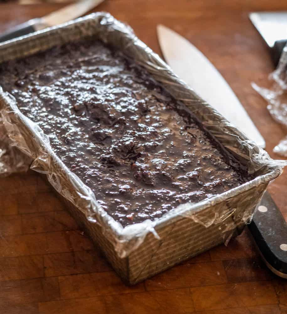 Putting blood cake batter in a loaf pan