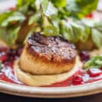 Seared scallops with highbush cranberry sauce, watercress, mint, pomegranite, and hummus (1)