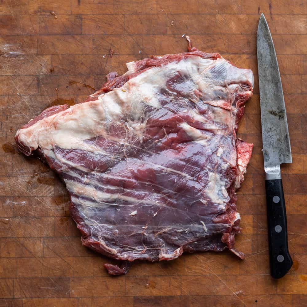 Trimming a venison flank steak