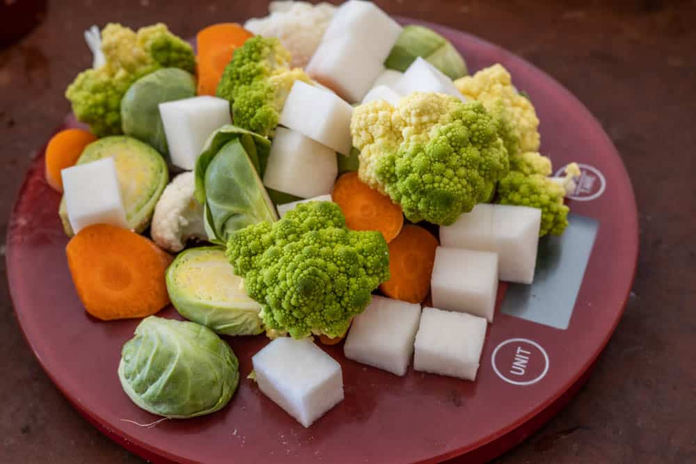 Vegetable hash ingredients: romanesco, bell peppers, turnips, Brussels Sprouts, cauliflower and carrots. 