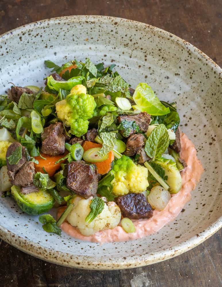 Venison shoulder hash with vegetables and spicy sour cream 