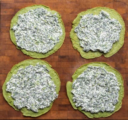 Filling green nettle crepes with nettle filling
