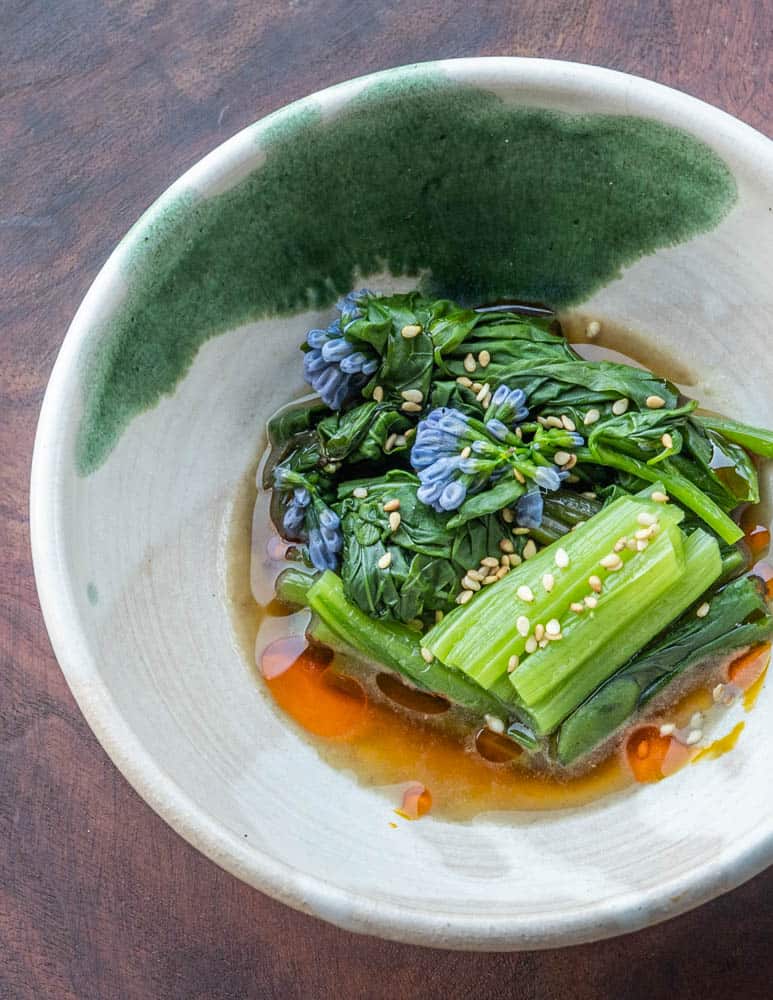 Virginia bluebells with mushroom broth and sesame 