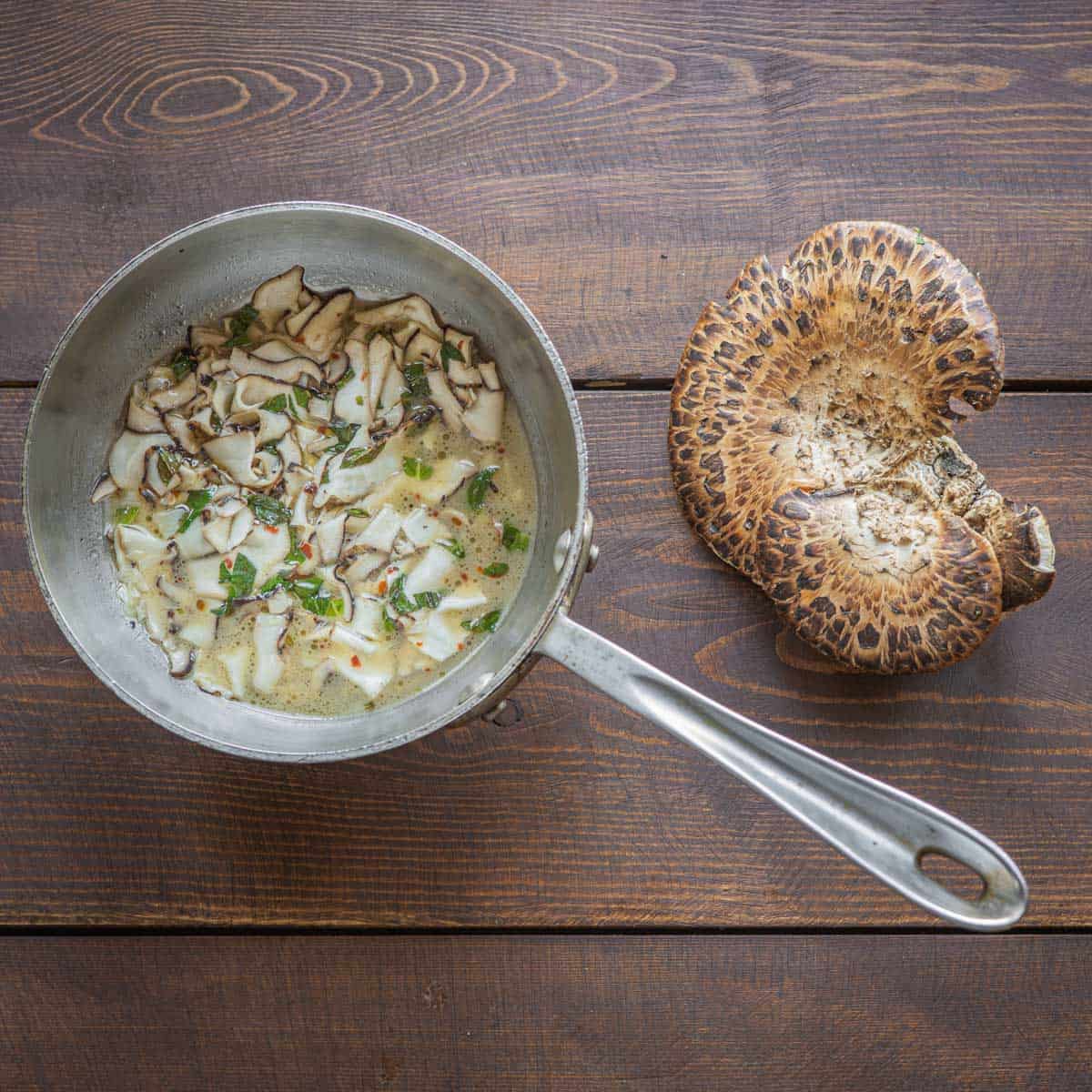 White wine pheasant back or dryad saddle mushrooms recipe with garlic and herbs
