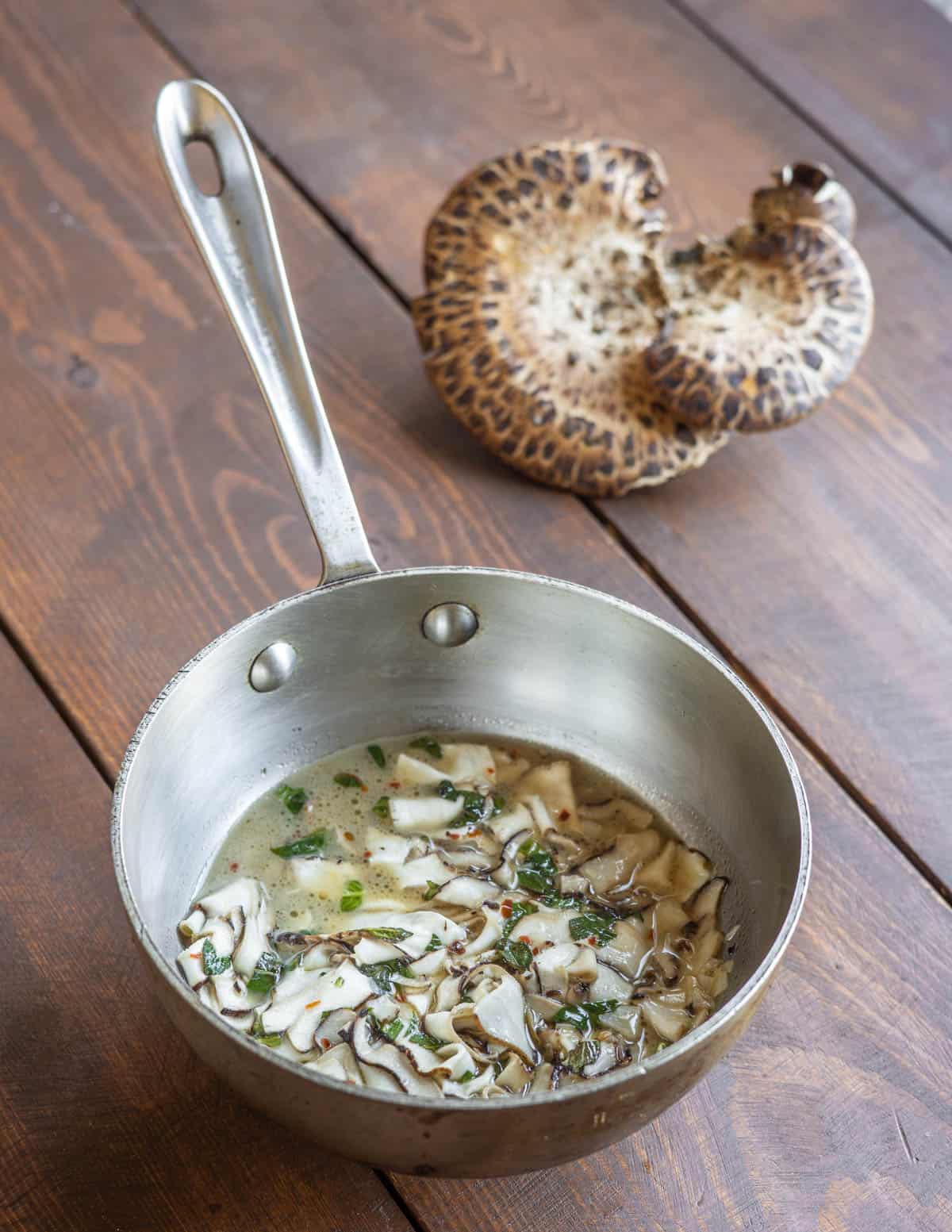 White wine pheasant back or dryad saddle mushrooms recipe with garlic and herbs