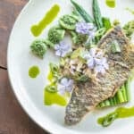 Trout with pheasant back mushrooms, spring shoots and ramp oil