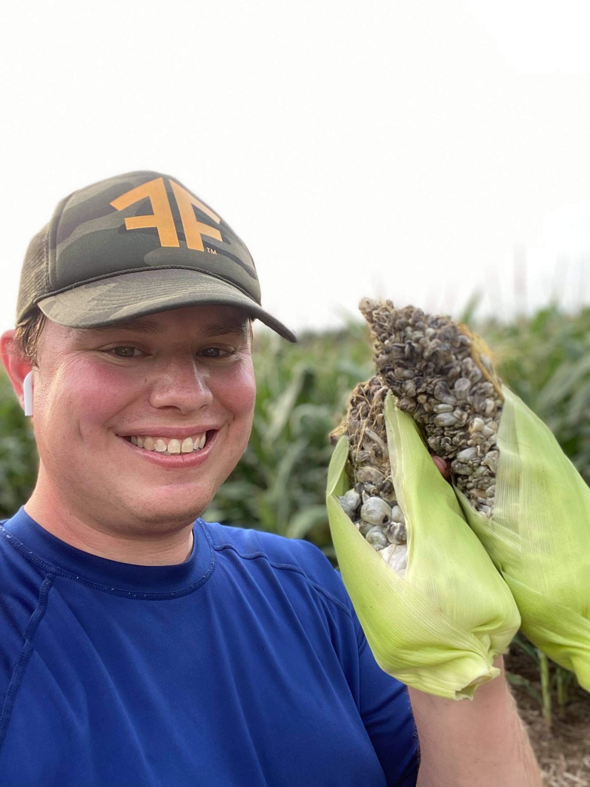 Mike Jozwik Mushroom Mike LLC with an ear of Wisconsin Huitlacoche 