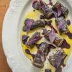 Mushroom and walnut sarmasi with black walnuts and wild grape juice