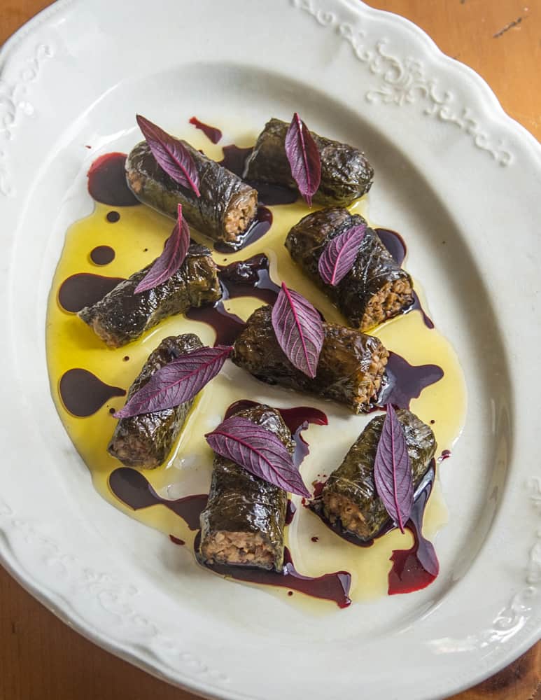 Mushroom and walnut sarmasi with black walnuts and wild grape juice