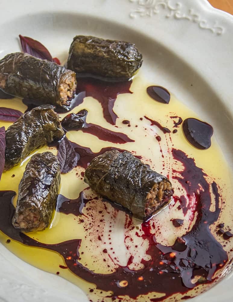 Mushroom and walnut sarmasi with black walnuts and wild grape juice