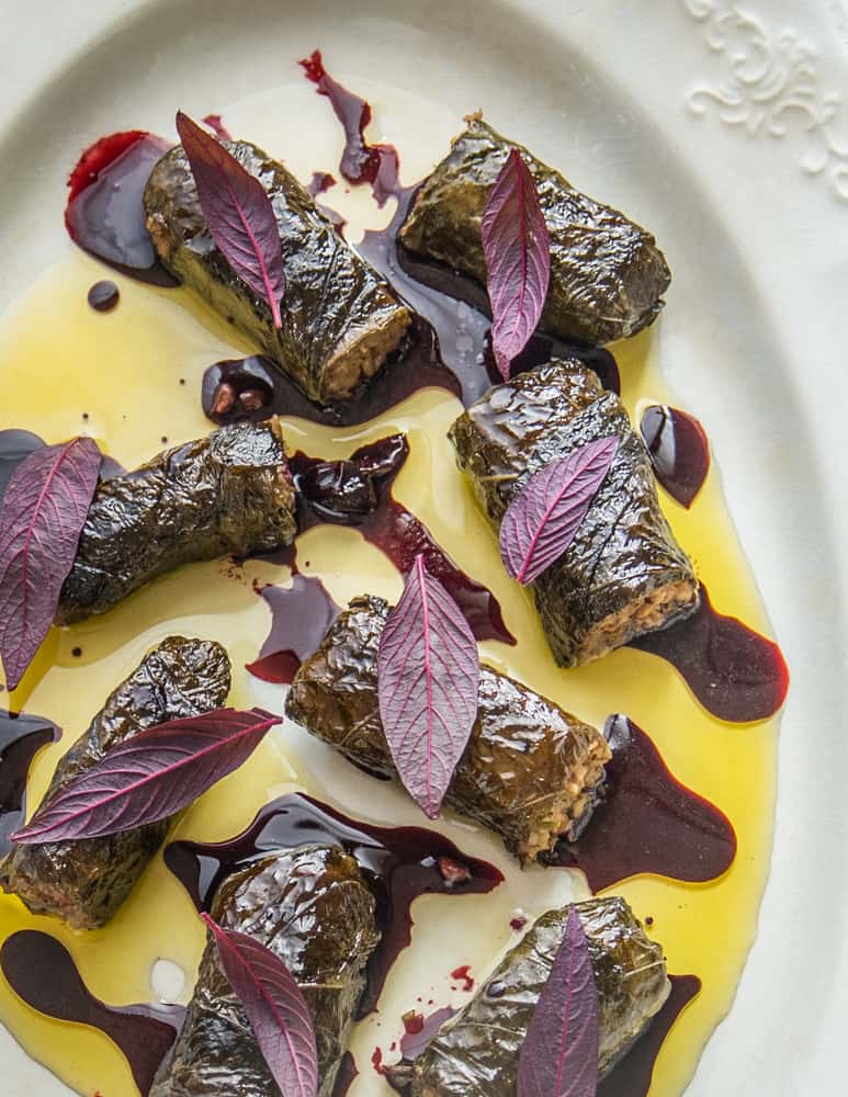 Mushroom and walnut sarmasi with black walnuts and wild grape juice