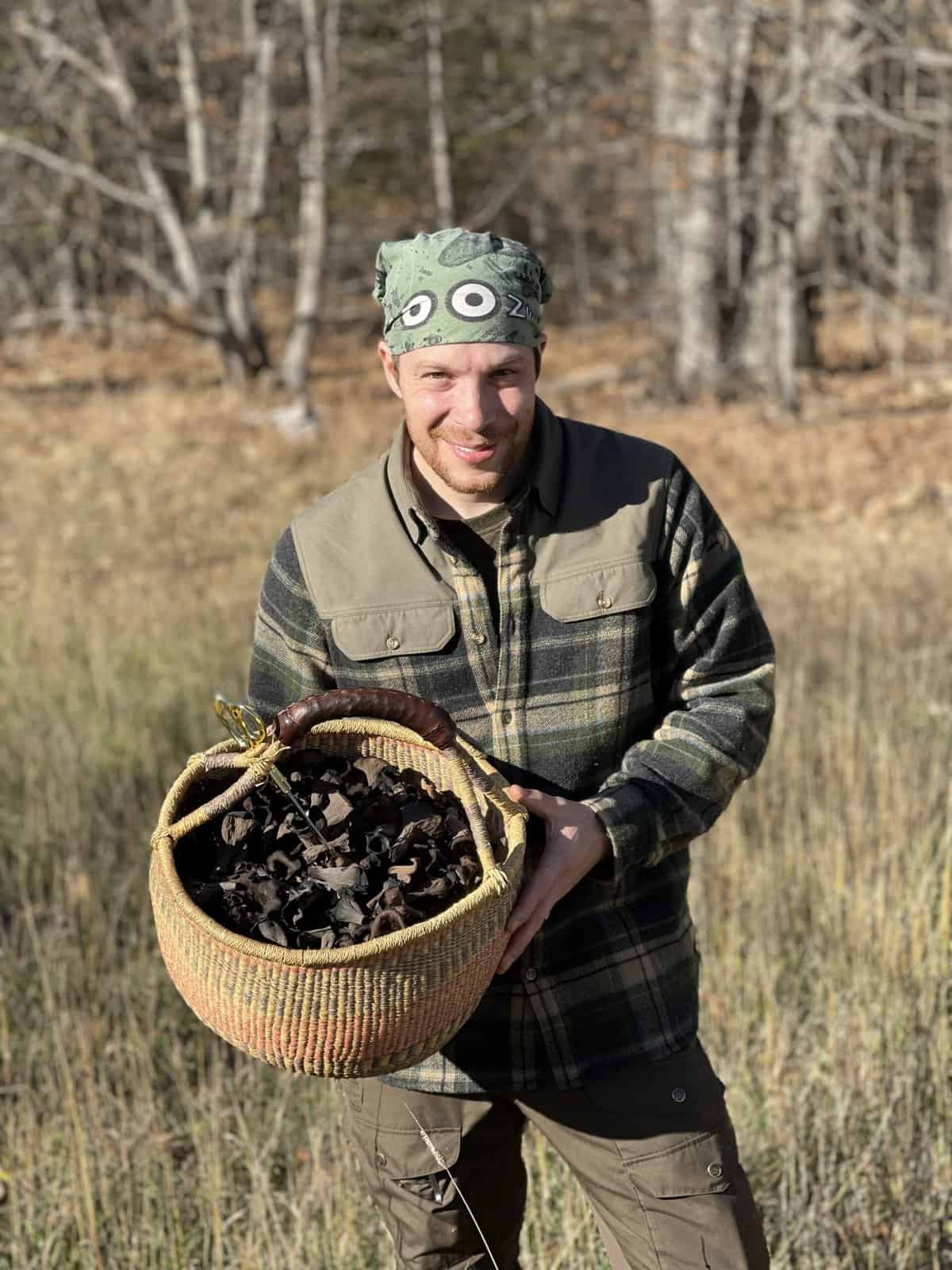 Chef Alan Bergo with a basket of black trumpet mushrooms