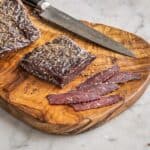 Elk Biltong sliced on a board