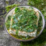 Marinated feta with golpar and green coriander