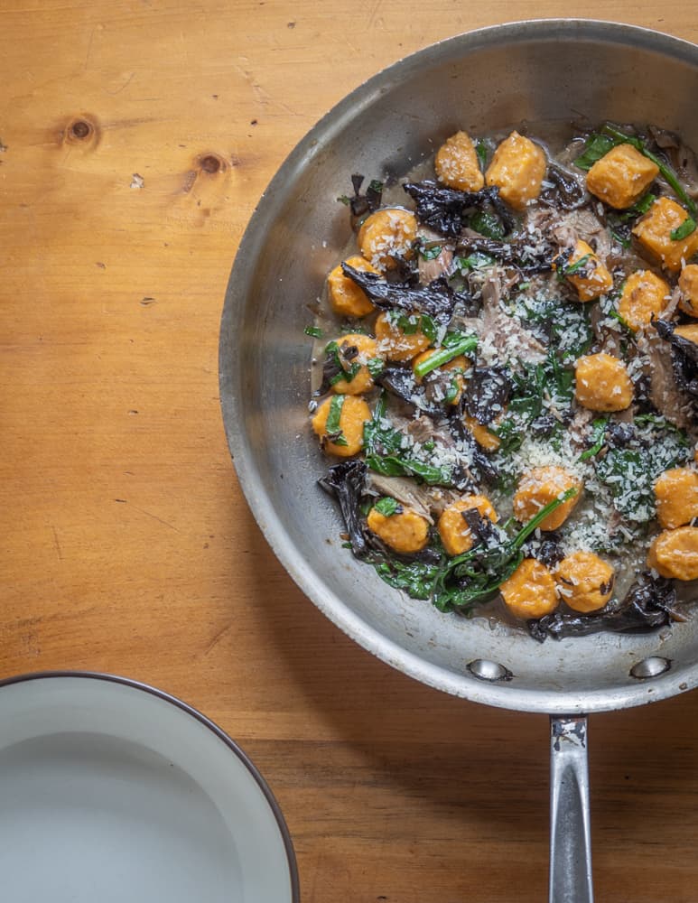 Sweet potato or squash gnocchi with black trumpet ragu, rabbit and spinach