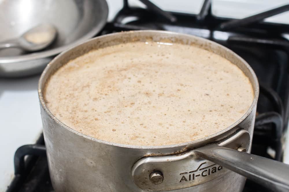 The foam on the top of a pot of hickory nut milk