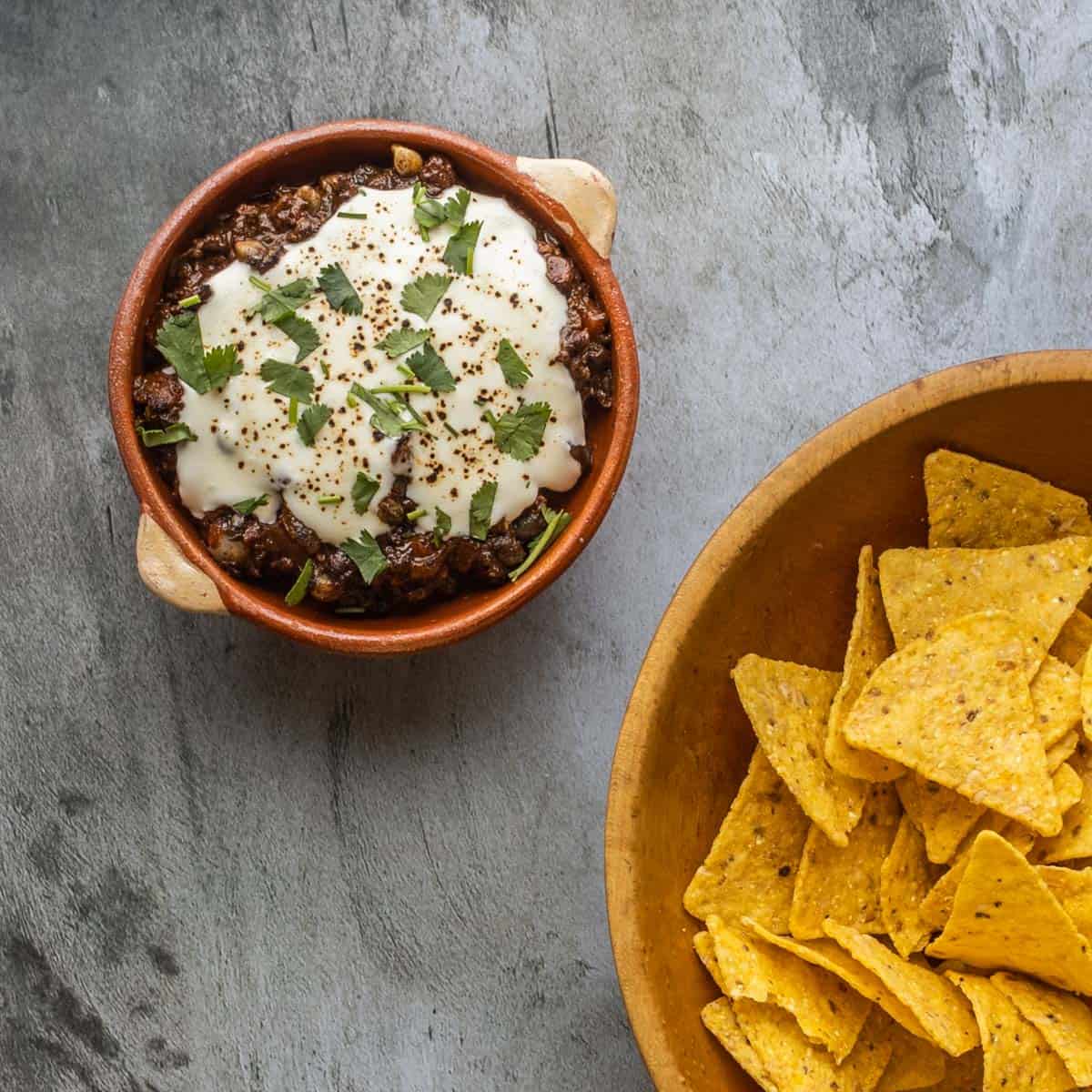 Huitlacoche choriqueso in a pan with chips