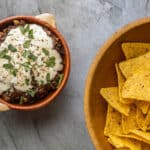 Huitlacoche choriqueso in a bowl with chips