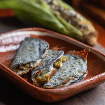 Quesadilla de huitlacoche cut into triangles