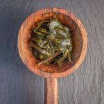 Fermented ramp leaves (Черемша) in a wooden ladle