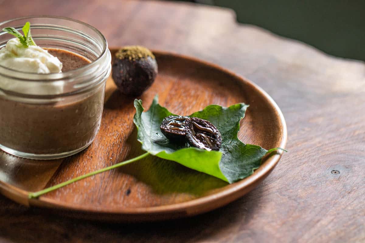 Green walnut jam as part of a dessert plate 