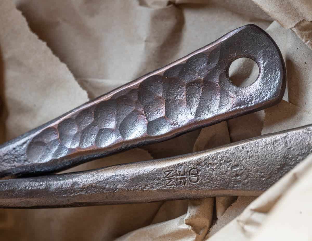 handle detail and artist mark on carbon pan handle