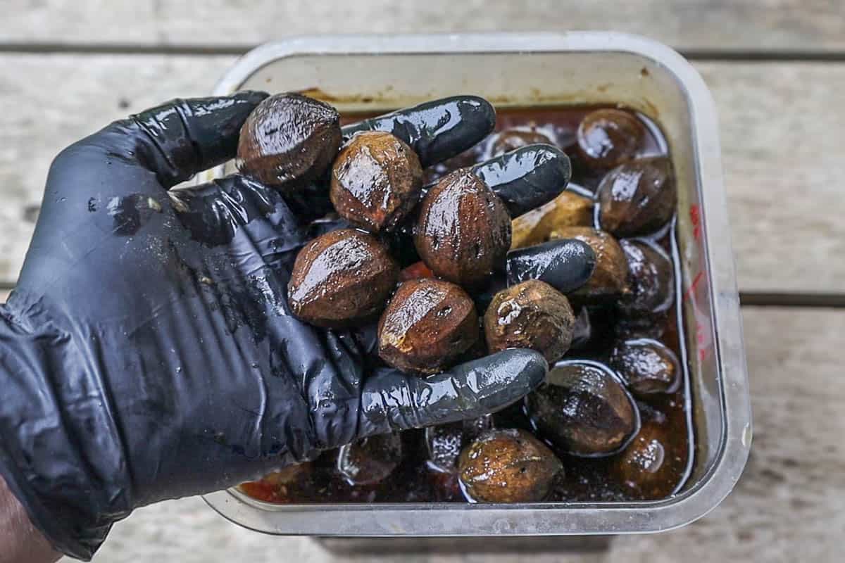 Soaking peeled green walnuts