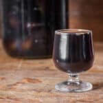 Black walnut wine or vin de noix in a glass