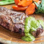 Grilled lamb barnsley chop with wild mint sauce and carrots