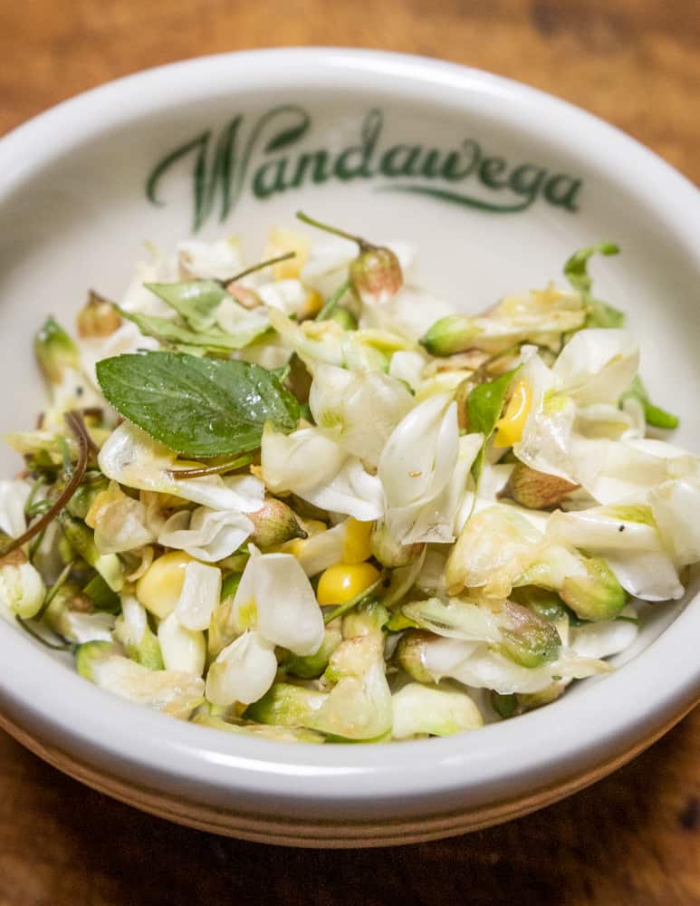 Cooked black locust flower salad with mint and sweet corn 