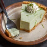 a slice of spruce tip key lime pie on a plate
