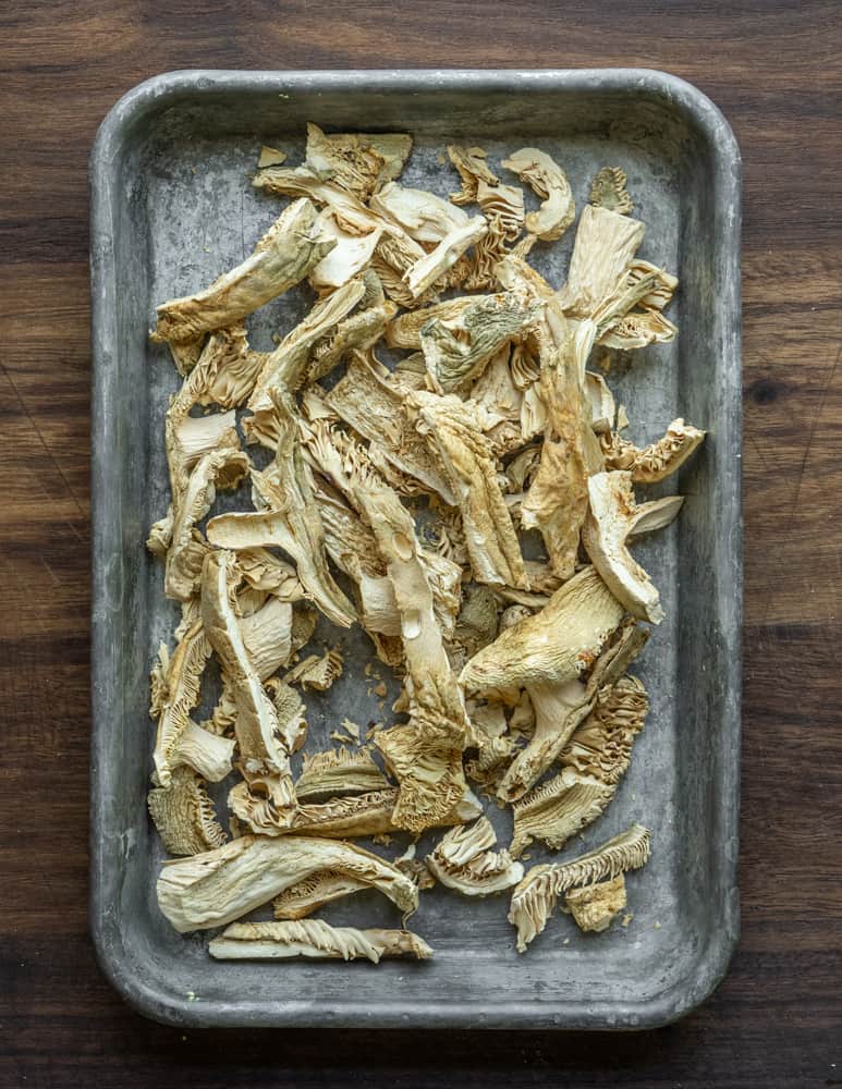 Dried or dehydrated russula parvovirescens on a tray. 