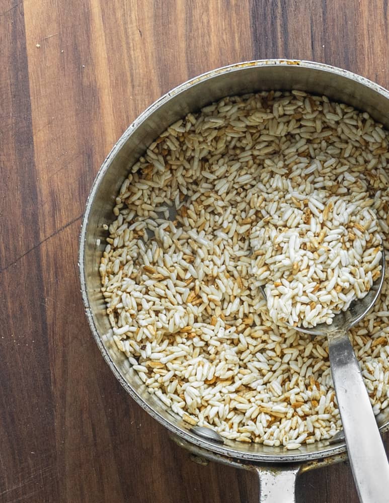 Toasting rice in a pan before cooking