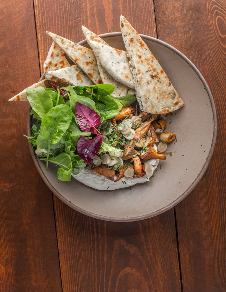 Mixed sauteed wild mushrooms with chipped cheese, flatbread and salad